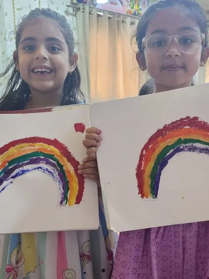 Another pair of happy artists with their colorful rainbow paintings. This was a popular project that everyone enjoyed.