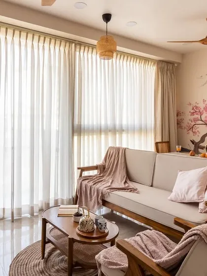 Another perspective of this tranquil living room, highlighting the soft textures and natural light that make the space feel warm and inviting.