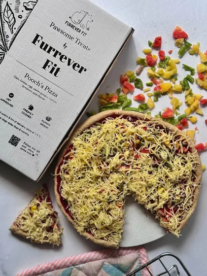 For a truly special occasion, I created the Pooch's Pizza. It's a fun, pizza-shaped treat made with 100% dog-friendly ingredients like cottage cheese, beetroot, and carrots. It's a guilt-free way to celebrate with your best friend.