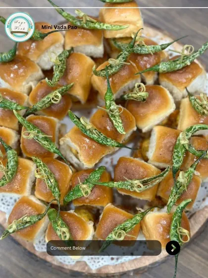 My Mini Vada Pao platter is a bite-sized version of the Mumbai street food classic. Soft pav buns are stuffed with a spicy potato vada and served with fried green chilies for that extra kick.
