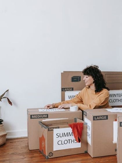 Make seasonal swap-outs easy. This image shows someone packing away clothes for the season. Our units are perfect for storing winter jackets in summer or festive decorations year-round.