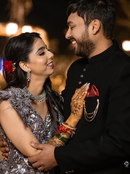 A candid moment of shared laughter between the couple. These unscripted interactions are what make a photo gallery feel alive and real.