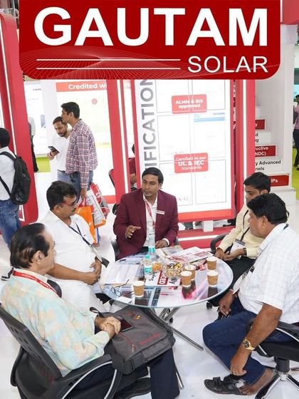Our team explaining the benefits of our solar modules to a group of interested attendees at the REI Expo 2024.