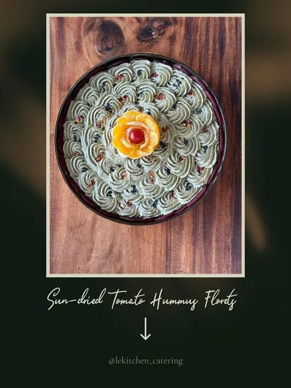Art on a plate. Our sun-dried tomato hummus is piped into beautiful florets and garnished with an orange peel rose, showcasing our attention to detail.