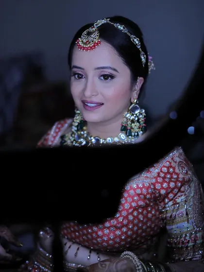 A beautiful candid moment of the bride looking in the mirror. Her soft smile shows her confidence and happiness with the final look.