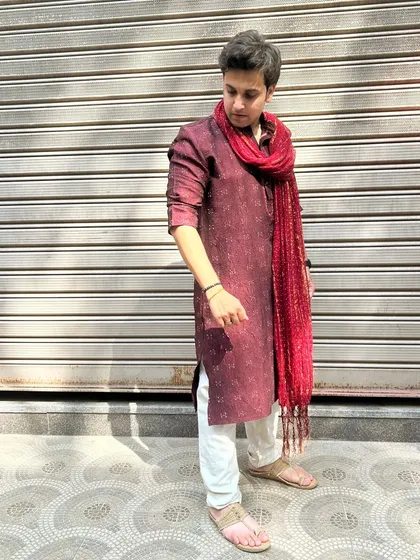 Another angle of my Diwali 2023 look. This photo highlights the texture and fall of the traditional fabric, showing attention to detail in styling.