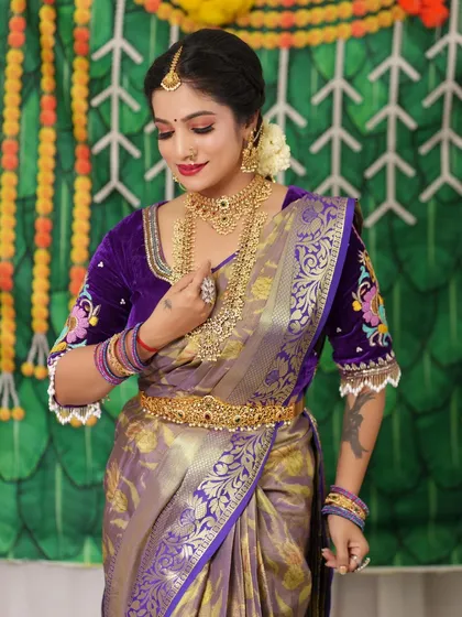 The full bridal look, complete with a waist belt, showcases a regal and elegant style.