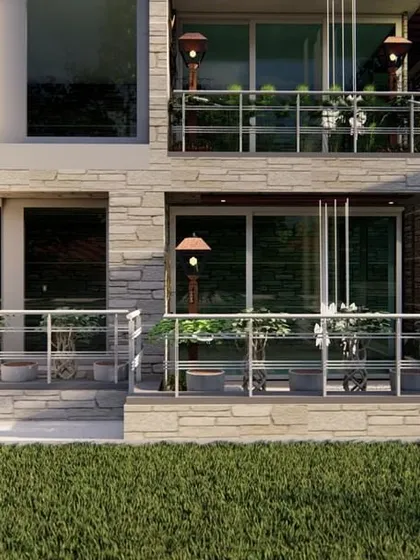 A view of a modern house exterior with green balconies on multiple levels, demonstrating our approach to holistic, multi-story landscape design.