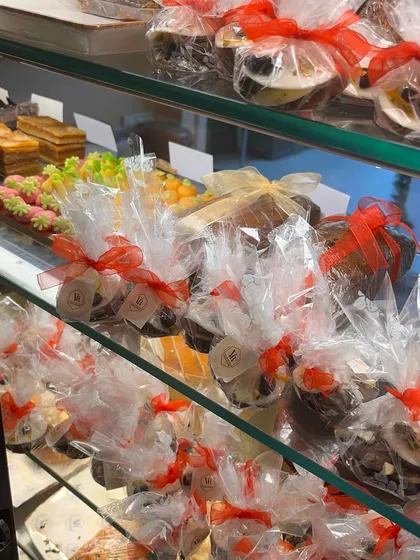 A look at the festive treats on display in my store. Here you can see individually wrapped mini cakes and other goodies, perfect for grabbing a quick, thoughtful gift.