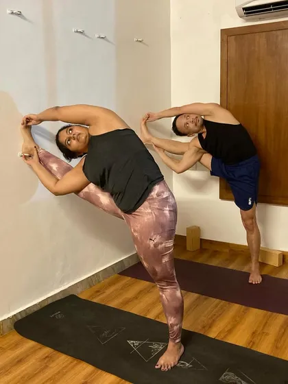 Stretching after a workout is essential. Here, my students are working on standing splits and side bends to release their muscles after a cardio-intensive class.