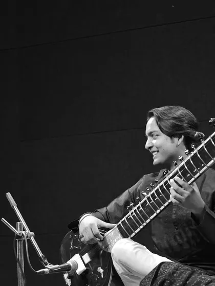 A black and white photo from the Swaraninad concert, capturing the timeless feel of a classical music performance.