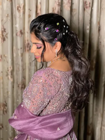 A glamorous ponytail for a sangeet night. I added crystal accessories to the hair for a touch of sparkle and drama, perfect for an evening event.