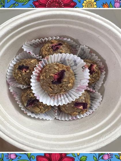 A bowl of my almond and walnut laddus, decorated with a floral border for a festive feel. These are a popular item in my Diwali gift hampers, offering a healthy alternative to traditional sweets.