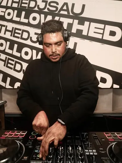 A clear shot of me working the mixer, with my branding prominent in the background.