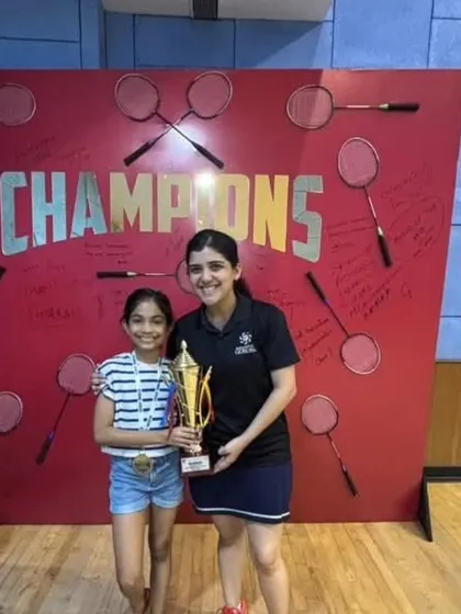 Antara celebrating her championship win with her coach, Asawari Parmar, highlighting the strong mentor-student bond we foster.