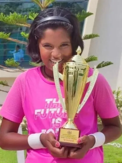 A close-up of Tamanna Nair, all smiles with her winner's trophy from the National Series doubles.