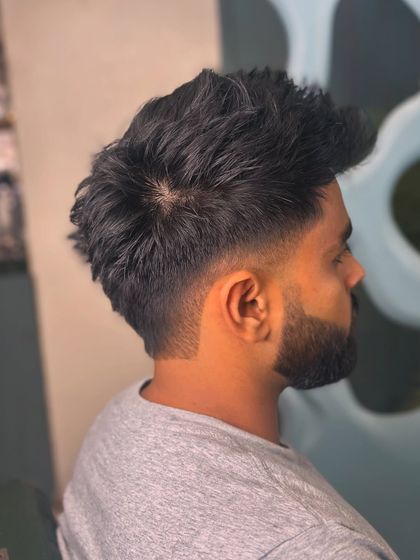 The back view of this textured cut, showing the volume and the clean taper at the neckline.