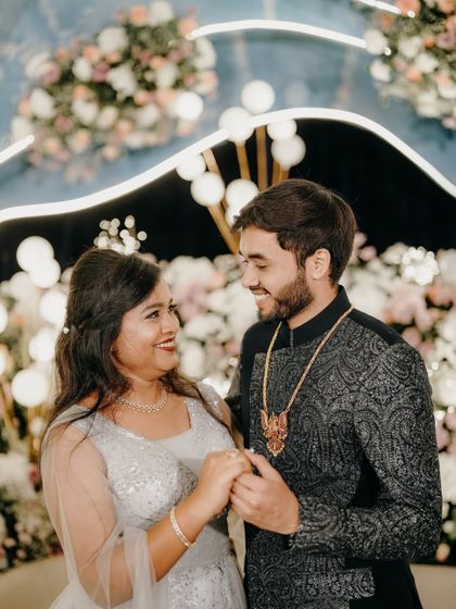 A candid moment of joy and laughter between the couple during their ring ceremony.