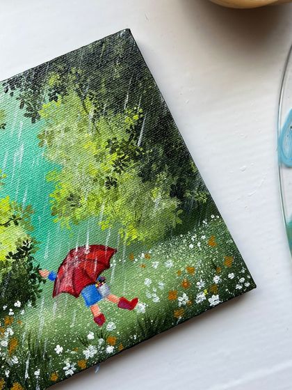 A close up of the rainy day painting, showing the texture of the rain and the bright red of the umbrella.