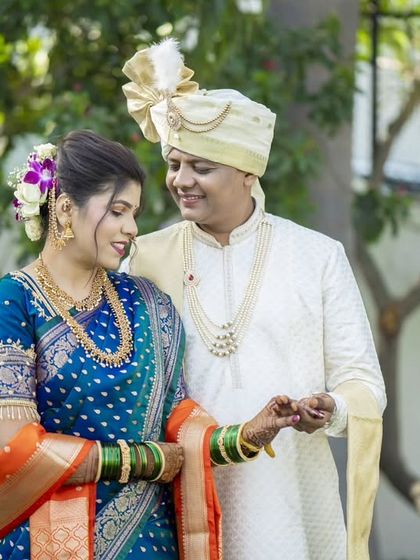 A tender moment between the couple, with the groom looking lovingly at his bride.