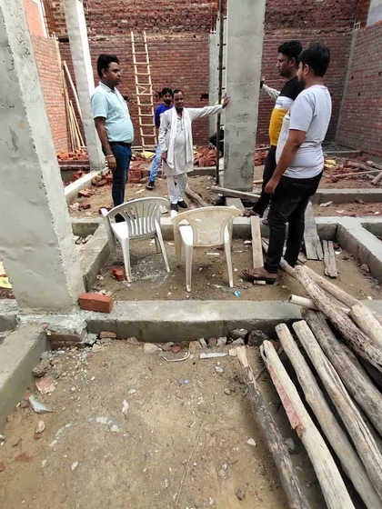 Here I am on-site with the team, discussing the structural plan within the foundation framework. These early-stage meetings are vital for ensuring the house is built on a strong and accurate base.