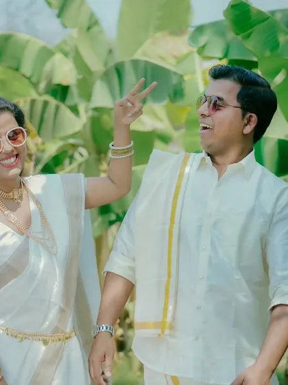 A fun, candid moment during a traditional photoshoot. Aditya and Priyanka's playful personalities shine through in this happy shot.
