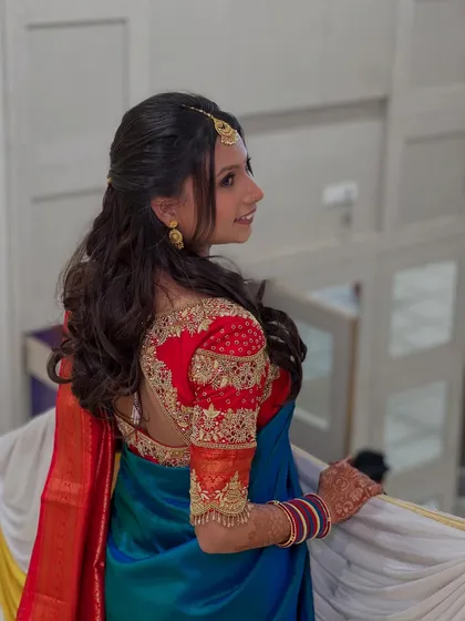 A full back view of the blouse and hairstyle, showcasing the detailed craftsmanship of the outfit.