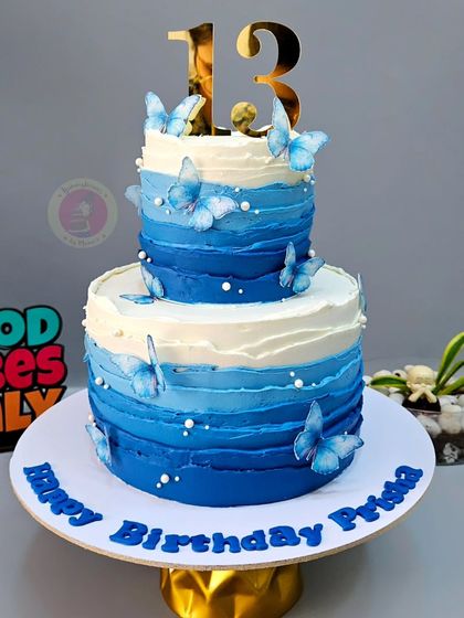 A closer view of the beautiful blue ombre butterfly cake.