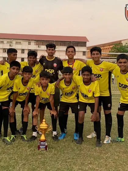 Posing with pride. The U14 squad and their championship trophy, representing Mumbai on a national stage.