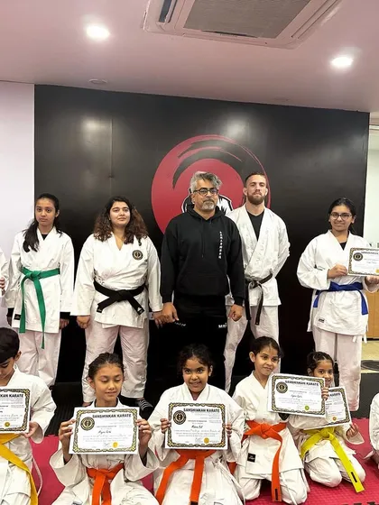 Our karate students proudly display their new belts and certificates after a successful belt test. We celebrate every milestone on their martial arts journey.