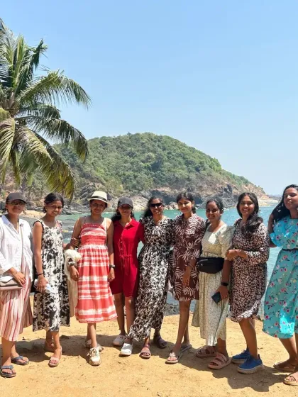A group of ladies enjoying the sun and sea breeze on a beach in Gokarna. Our trips are safe and popular among female travelers.
