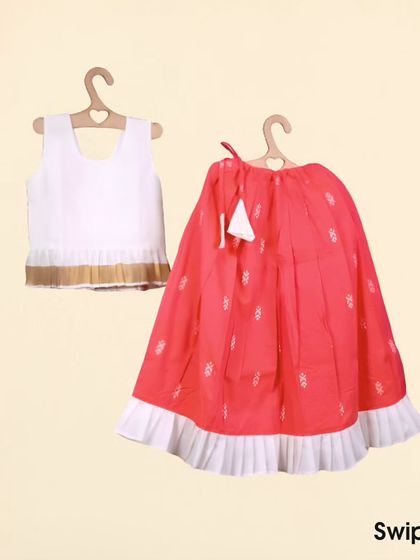 This is my Nila set, shown as a flat lay. You can see the off-white Kasavu peplum top and the contrasting peach skirt with its pretty white frill. It's a gorgeous outfit for any festive event.