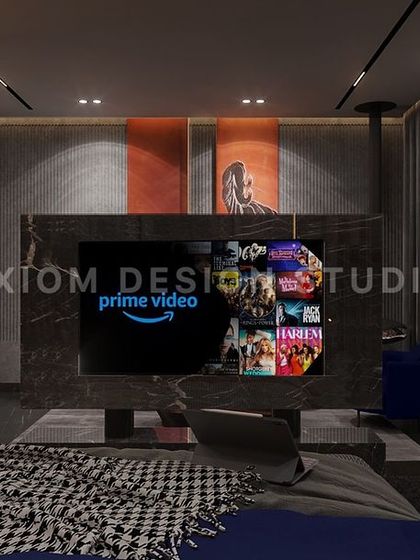 The centerpiece of this room is a rotating TV unit, allowing for viewing from both the bed and the separate seating area. This is a great example of how we design for modern lifestyles.