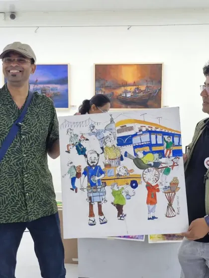 Presenting the finished artwork, now with color, at the Kolkata art exhibition.