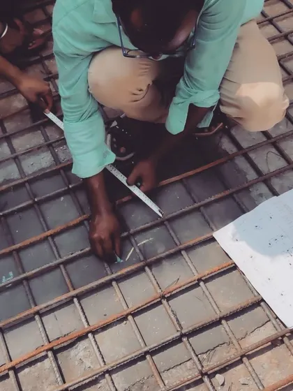 Another shot of our engineer meticulously checking the rebar placement against the structural drawings, ensuring complete accuracy.