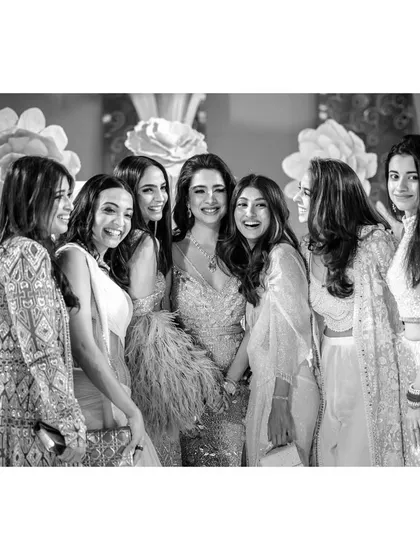 Sanjana and her girls. This happy, photogenic group of friends surrounds the bride-to-be with love and laughter, a beautiful portrait of sisterhood.