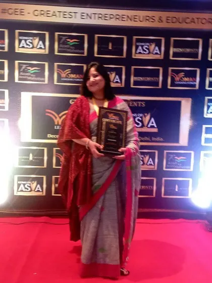 Posing with my award. These moments are not just personal achievements, but a celebration of every woman who has trusted me with her story and her growth.