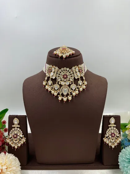 The full 'Ziva' necklace set on a display bust.