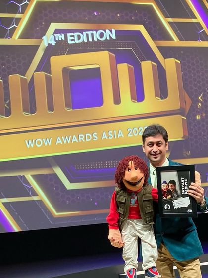 Posing with my puppet and the award at the 14th Edition of WOW Awards Asia. It's always special to share these moments with my partners on stage.