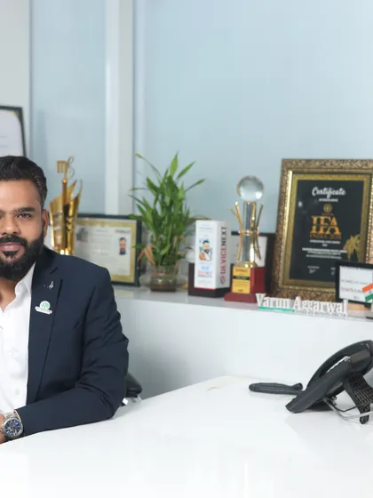 A formal portrait of me in my office. This image reflects the professionalism and serious commitment I have to my clients and the art of wedding photography and filmmaking.