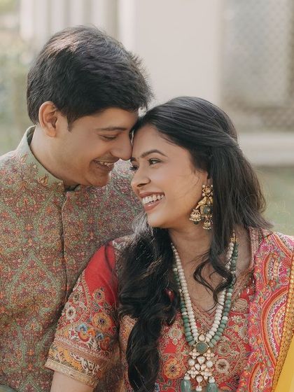 Tanya and Suyash share a joyful, natural moment. This portrait captures their easy laughter and genuine affection, showcasing a love that is both elegant and full of fun.