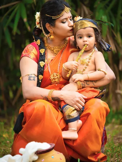 A tender kiss from Yashoda to her beloved Krishna. These outdoor sessions allow for beautiful, candid moments that feel timeless.