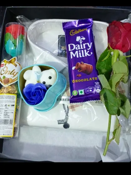 A classic birthday or anniversary hamper with a white shirt, chocolates, and decorative soap roses.