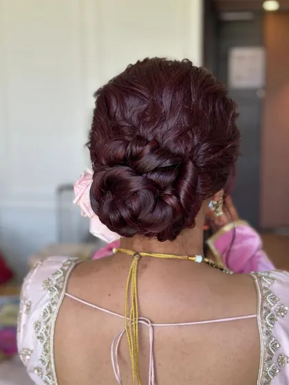 A close-up shot that highlights the texture and twists of this intricate bridal bun.