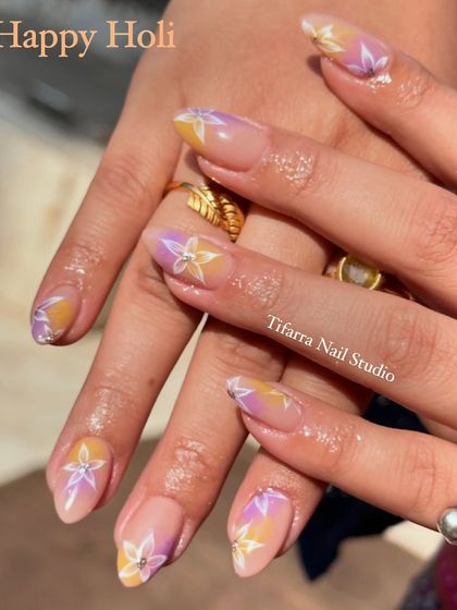 Happy Holi. A still shot of the soft and dreamy pastel floral nails, perfect for a festive yet sophisticated look.