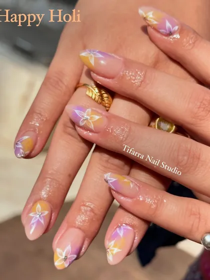 Happy Holi. A still shot of the soft and dreamy pastel floral nails, perfect for a festive yet sophisticated look.