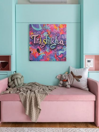 A happy space is a colorful space. This room for a young girl uses a cheerful palette of pastel blue and pink, with a personalized art piece and plenty of soft textures to make it feel cozy and fun.