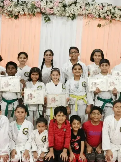 The full class from our Rejoice International School branch. This picture shows the size and diversity of our community, with students across various age groups and belt ranks.