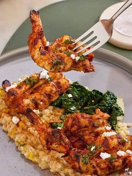 For a satisfying and flavorful meal, I recommend the Smoked Chili Grilled Prawns. They are served over a fresh corn and barley risotto with a salty feta crumble and a zesty picante salsa.