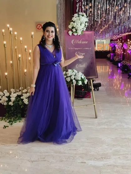 Dressed for an elegant engagement party. I always coordinate my attire to match the theme and formality of your event, ensuring a professional look.